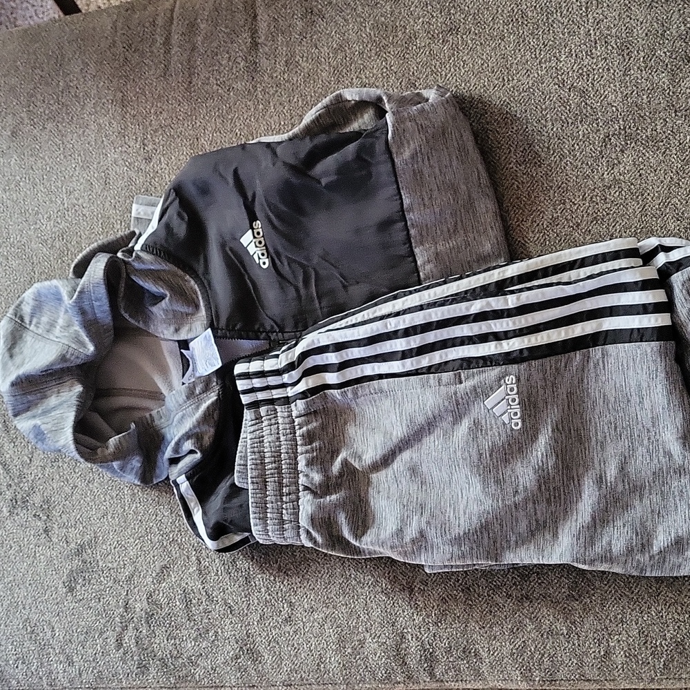 Adidas track suit.
